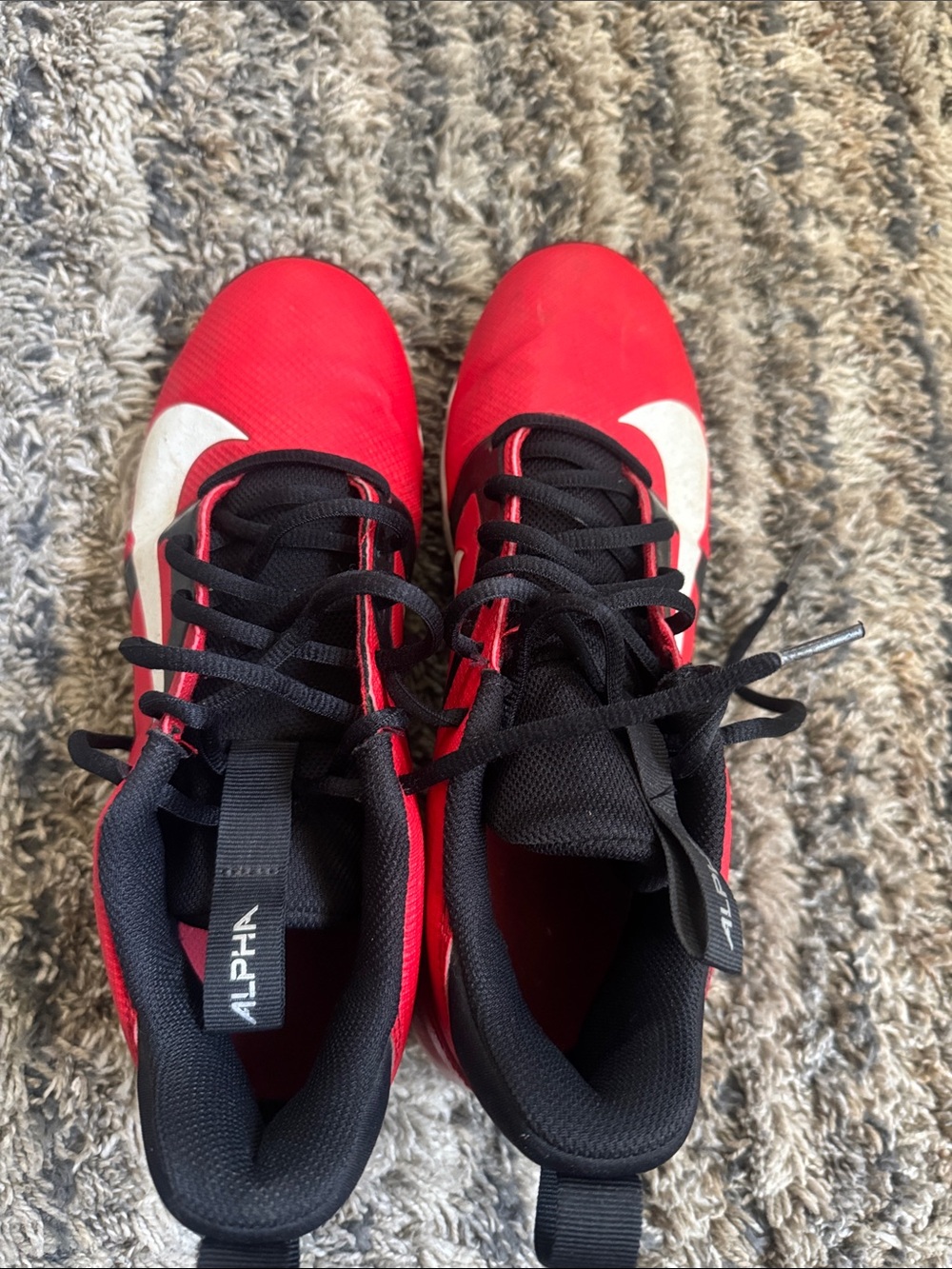 Nike Men’s Red and Black Football Cleats with White Nike sign
